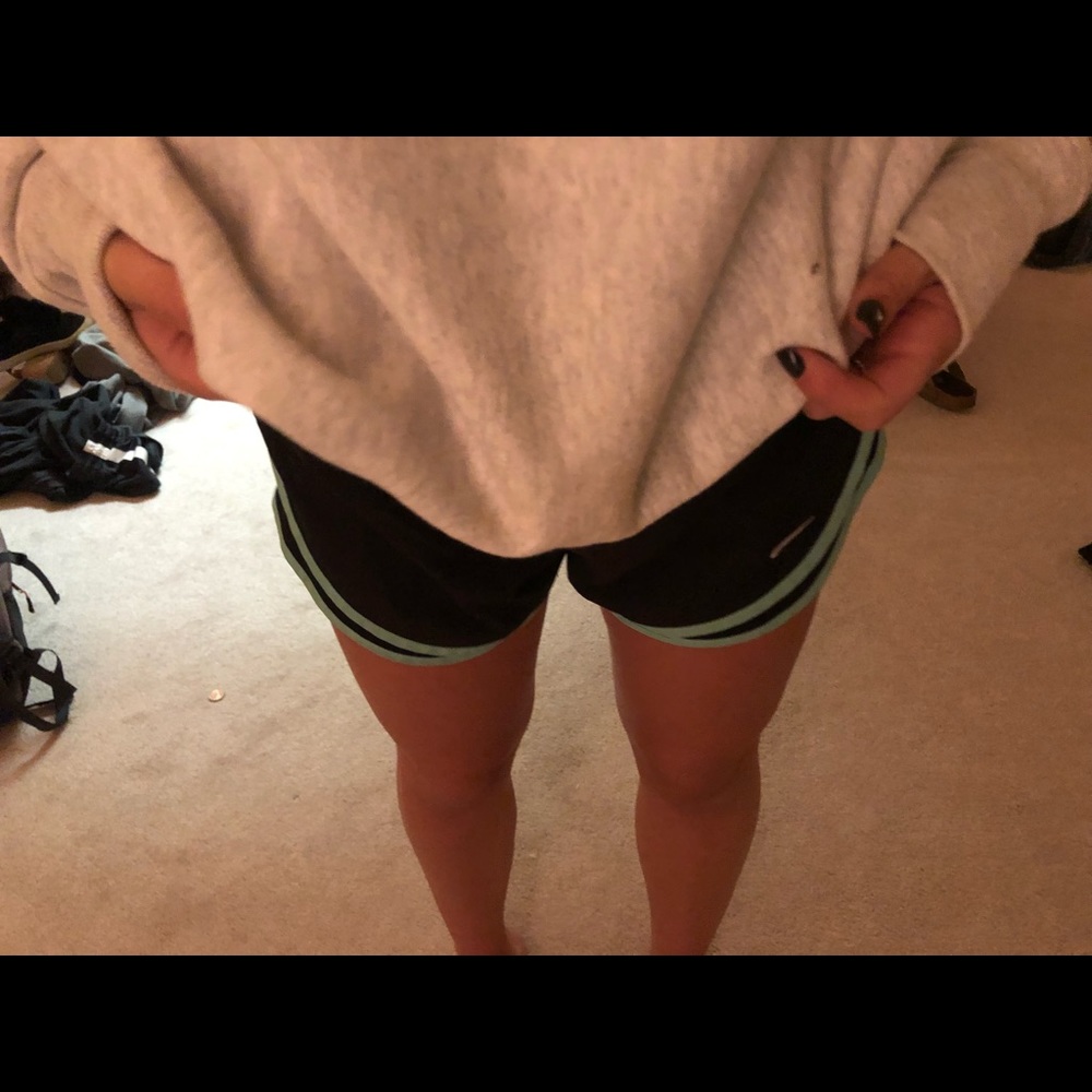 Black and green trim Nike shorts